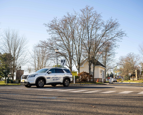 Front View Of Ironrock Security Car Parked In Front Of Residential Area