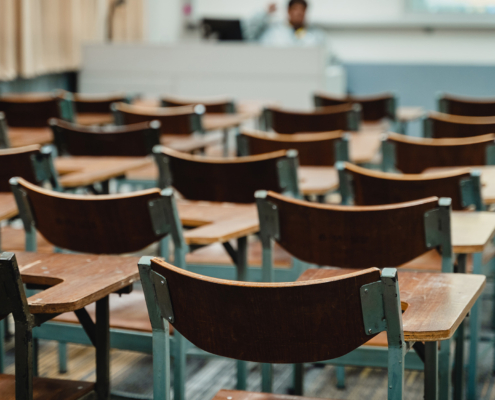 Wooden Lecture Chairs Arranged In The Classroom